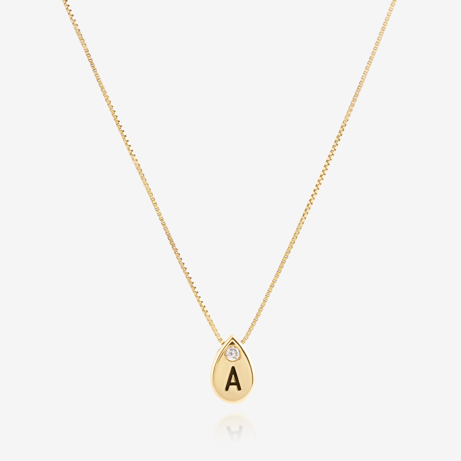 Nik Jewellery personalized 14K gold teardrop initial necklace with diamond accent on 16 inch chain.