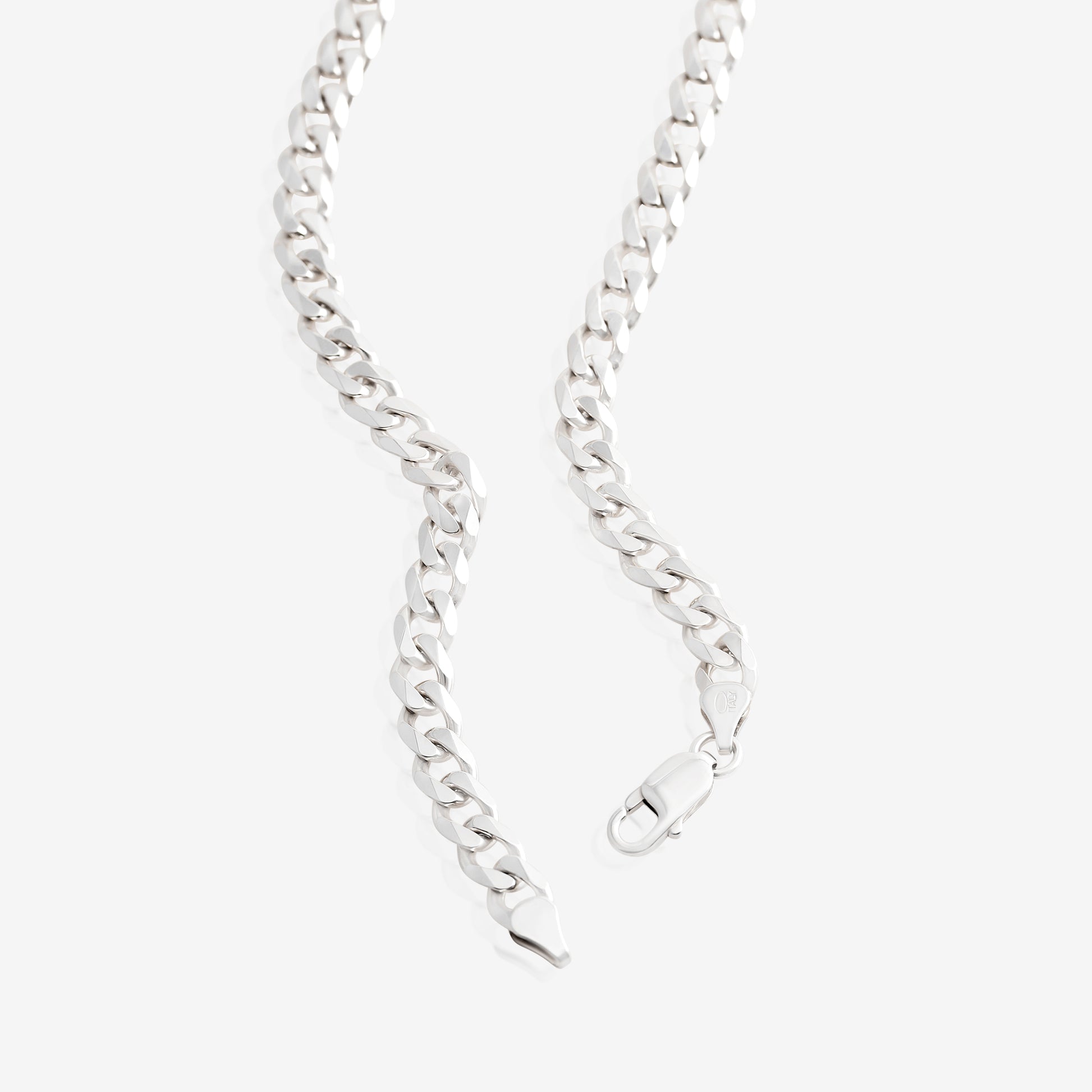 Nik Jewellery silver curb chain necklace close-up showing 7.5 mm flat interlocking links.