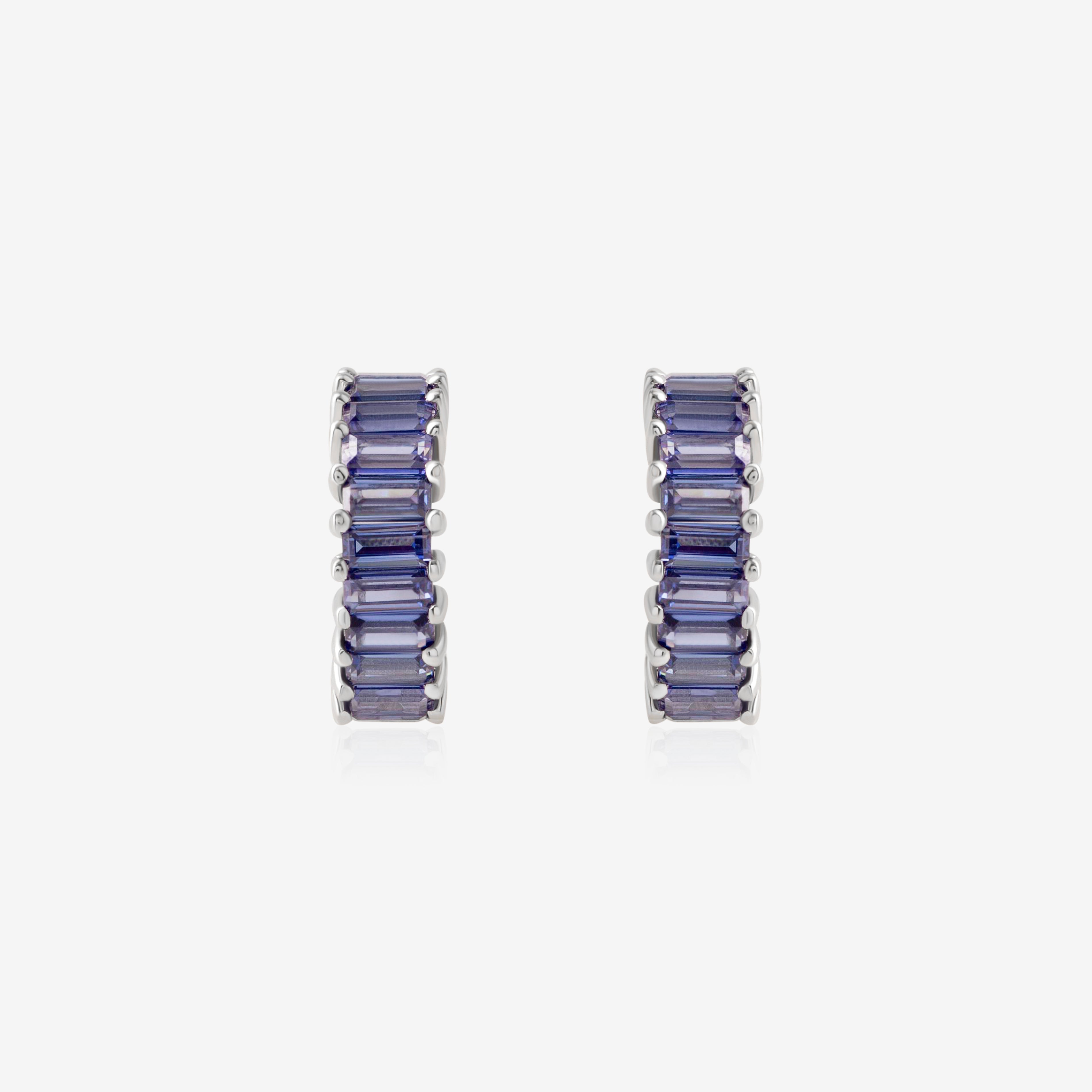 Nik Jewellery Azure 18K white gold 10 mm huggie earrings with blue baguette sapphires, front view.