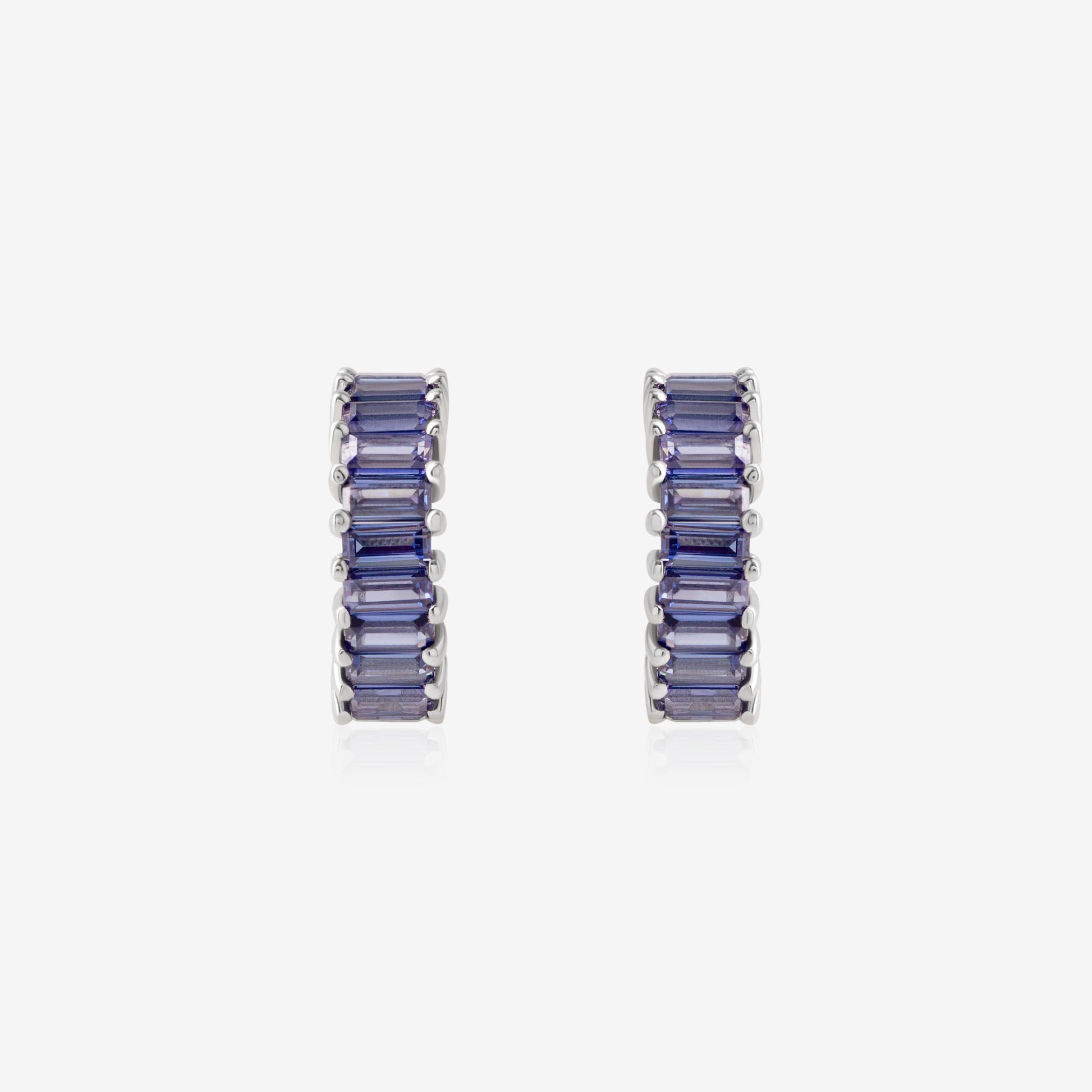 Nik Jewellery Azure 18K white gold 10 mm huggie earrings with blue baguette sapphires, front view.