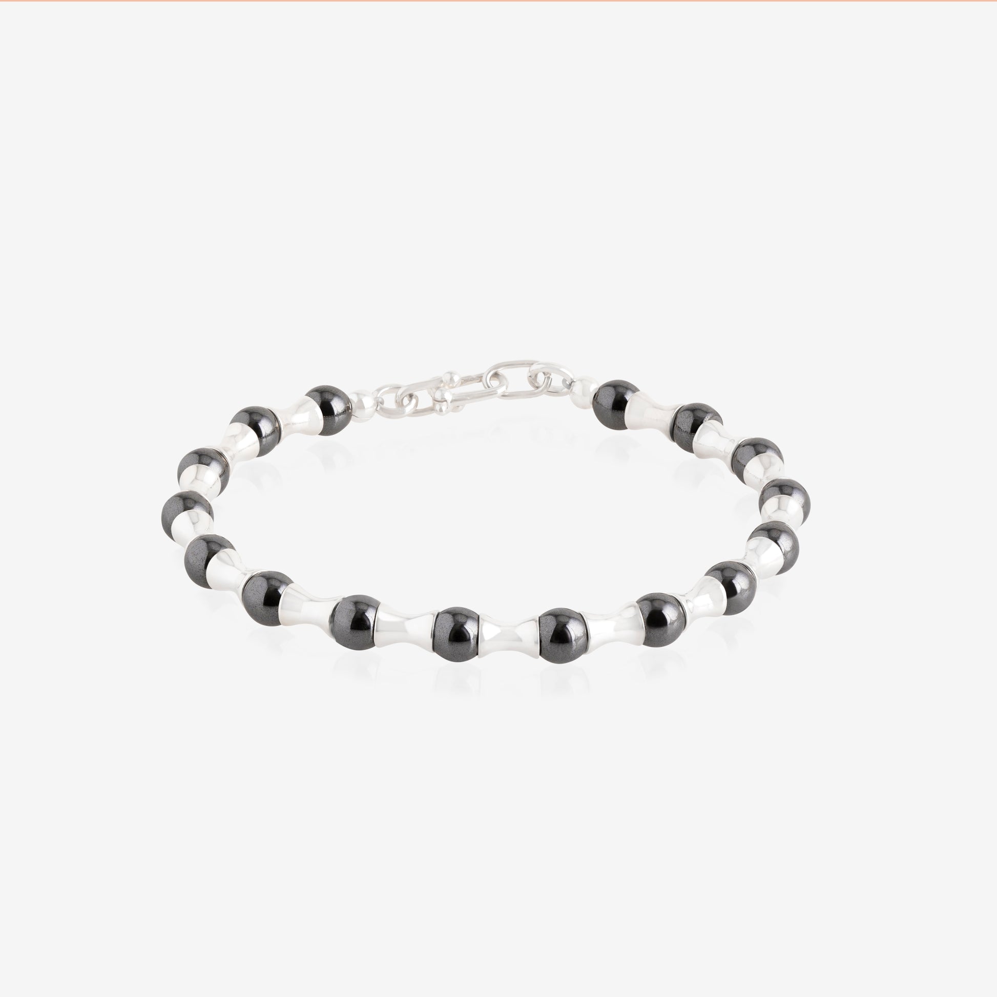 Nik Jewellery hematite and sterling silver men’s bracelet, full view showing alternating beads and sculpted links.