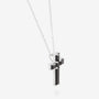 Nik Jewellery Noir sterling silver black baguette cross necklace, angled view showing prong setting and side profile.