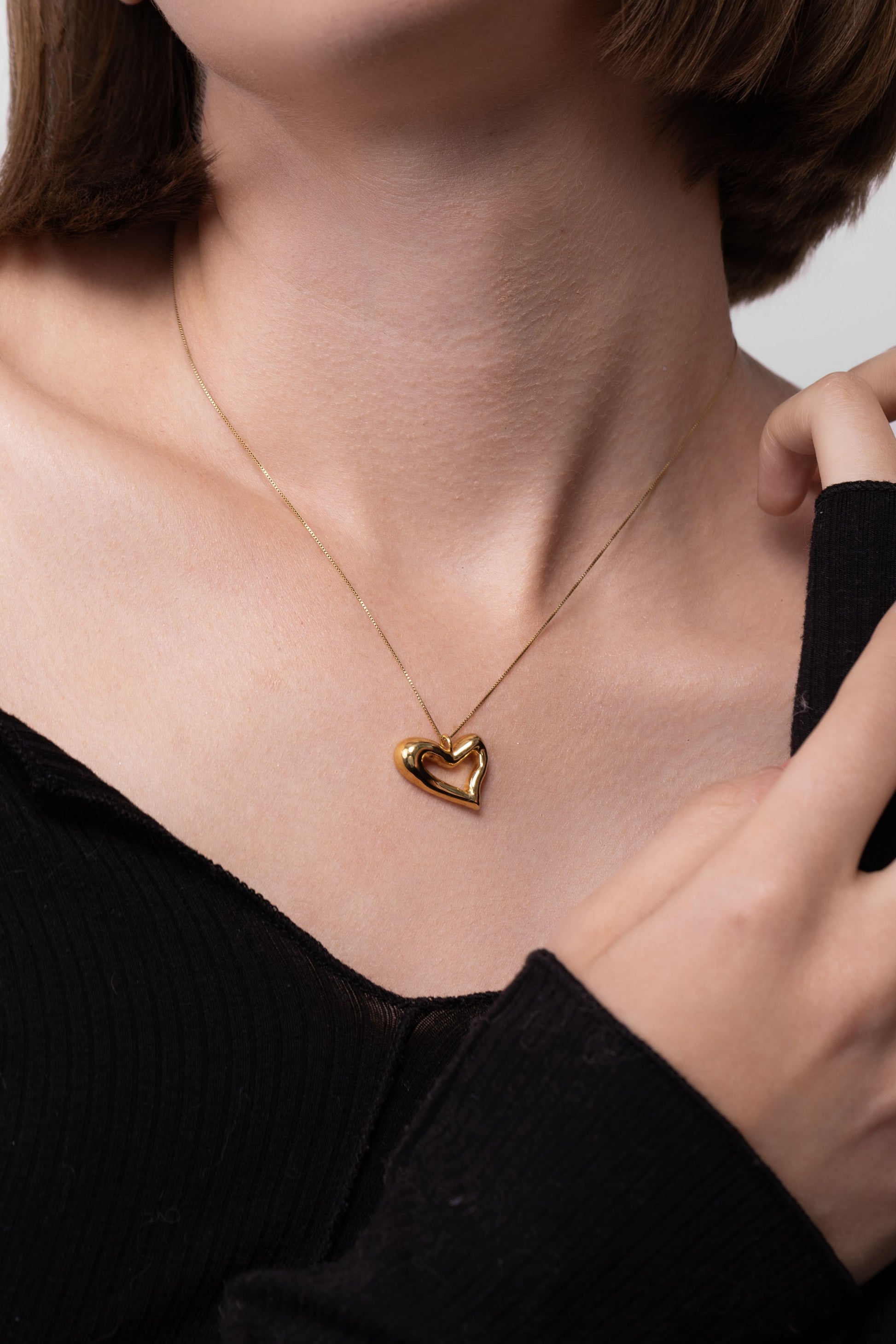 Nik Jewellery Seren gold vermeil open heart pendant necklace worn on neck, showing size and placement.