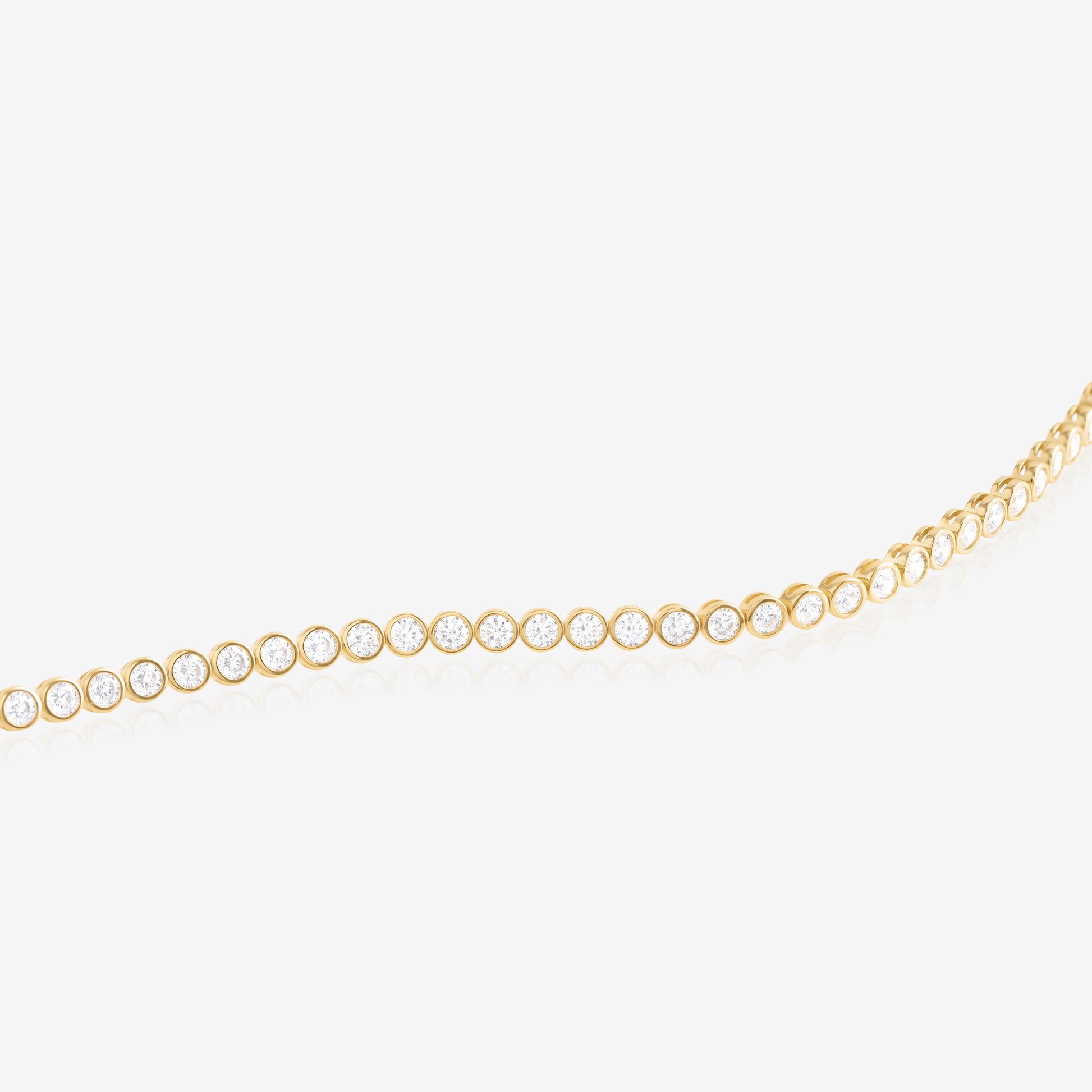 Nik Jewellery Solis tennis bracelet close-up showing bezel set round lab-grown diamonds in 14K gold.